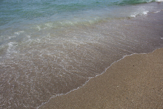 Ocean Waves Crashing on the Sand beach spain unedited raw blue water breaking sea foam surf shore mediterranean coast resort holiday vacation travel island photography image photo high resolution png