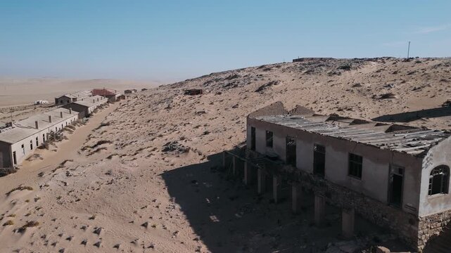Abandoned diamond ghost town of kolmanskop in the namib desert, namibia, africa