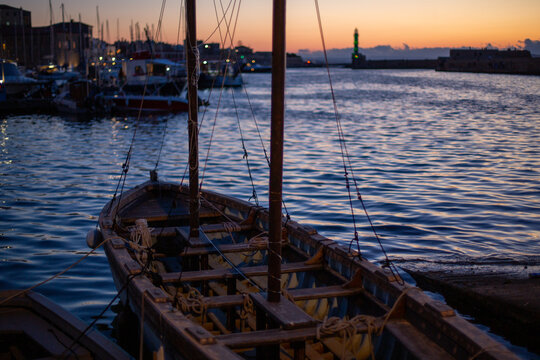 boats at sunset in hania, greece crete