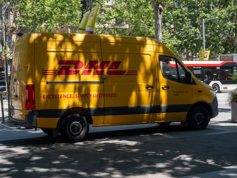 DHL Yellow Delivery Van Parking on City Street Barcelona
