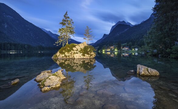 Hintersee at dusk, rocks illuminated by lamp, Ramsau, Berchtesgadener Land, Berchtesgaden National Park, Upper Bavaria, Germany