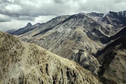 Daliz Pass, scree landscape, behind it summit of the Hindu Kush, Wakhan Corridor, Badakhshan, Afghanistan