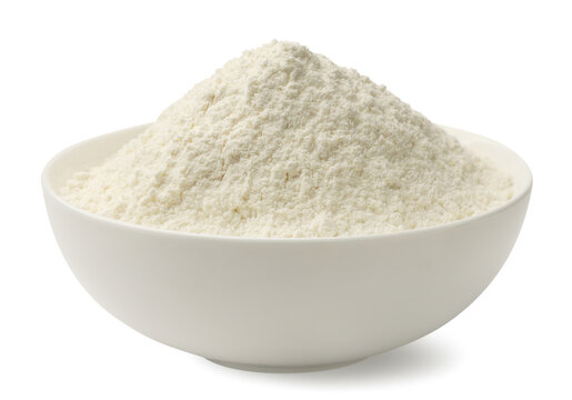 Wheat flour in a bowl on a white background. Isolated
