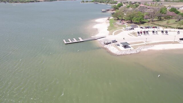 Aerial video of Lake Waxahachie in Texas boat ramp at Boat Dock Park. Video is heading approximately west flying over the boat ramp.