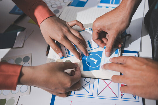 UI designer and UX developer brainstorm idea to design the application appearance in the early stage. Creative digital development agency. UX UI concept