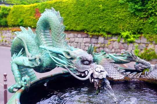 Traditional Japanese Bronze Dragon Fountain for Ritual Purification at Shinto Shrine