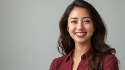 Obraz premium Smiling asian woman in red shirt for business portrait