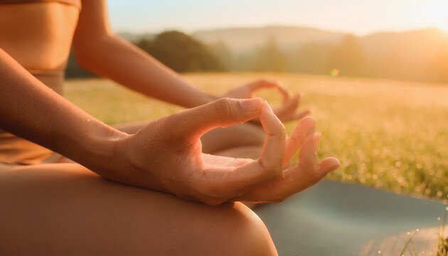 Close Up of Female Hands Meditating During Sunrise Yoga