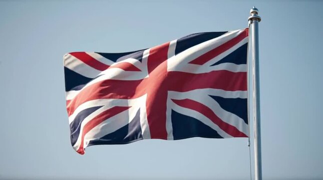 The United Kingdom flag waving freely outdoors.