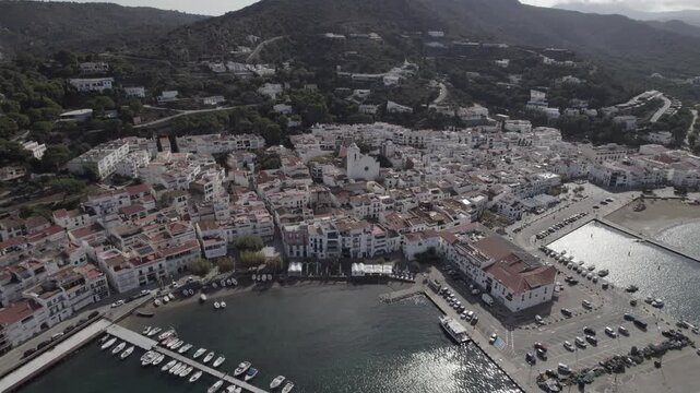 Aerial Drone Push In Towards Port de la Selva Town with Church in Centre, Costa Brava, Spain