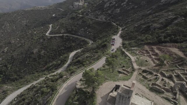 Aerial Drone Tracking Shot from Church Ruins Along Path to Sant Pere de Rodes Monastery, Costa Brava, Spain