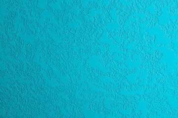 Obraz premium Blue textured surface with rough stucco finish
