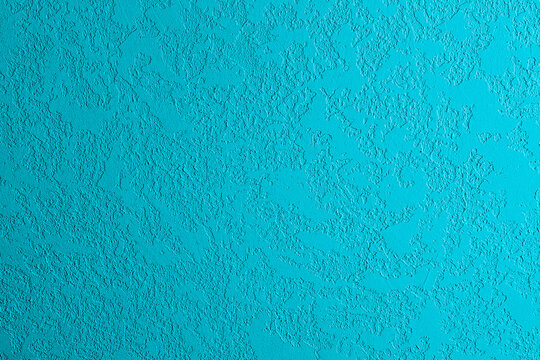 Blue textured surface with rough stucco finish