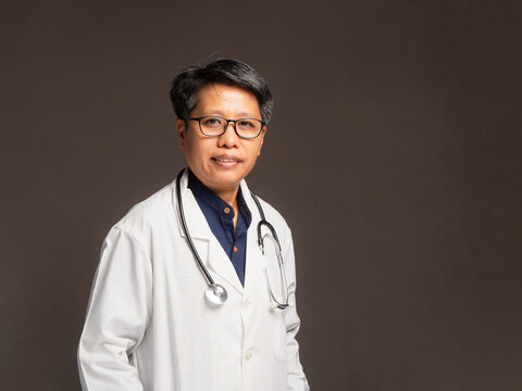 Female doctor in white coat with stethoscope portrait