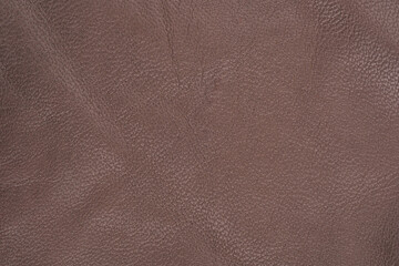 Fototapeta premium Brown leather fabric with a textured surface