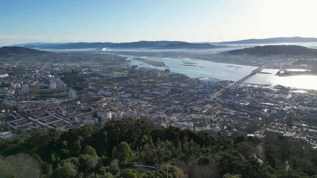 Low-angle panoramic view of Viana do Castelo, Cabedelo, and the port, also capturing the Viana bridge linking the city to Cabedelo, with coastline and maritime scenery.