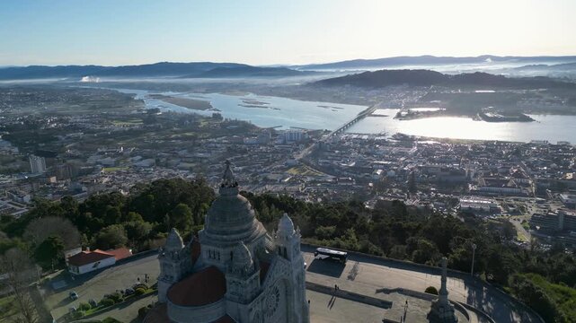 Aerial view near the Santa Luzia Sanctuary with Viana do Castelo and the Lima River behind on a clear cold sunny day, showing city, river, and crisp winter atmosphere.