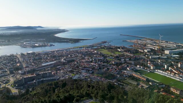 Low-angle panoramic view of Viana do Castelo, Cabedelo, and the bustling port, showcasing the coastline, maritime activity, and scenic beauty on a clear day.