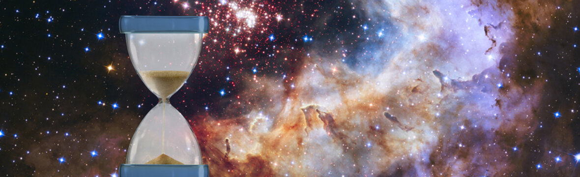 An hourglass stands in space, filled with sand. Stars and galaxies surround it, highlighting the concept of time passing in the universe. The scene is dark and filled with color.