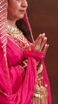 Vertical Closeup Shot of Indian Bride and Groom Praying at Wedding Day