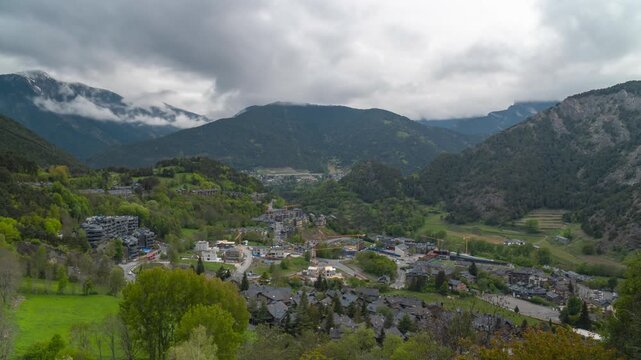 Timelapse of Ordino, a village in the mountains of andorra from daytime to evening as clouds move fast