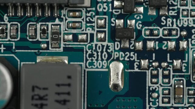 Electronic circuit board showing detailed traces and components. Useful for technology presentations and educational content on electronics.
