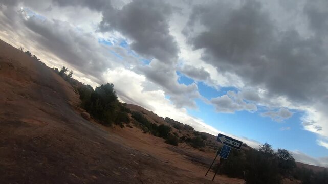 Scenic side by side ride across Moab landscapes with towering cliffs and wide open desert