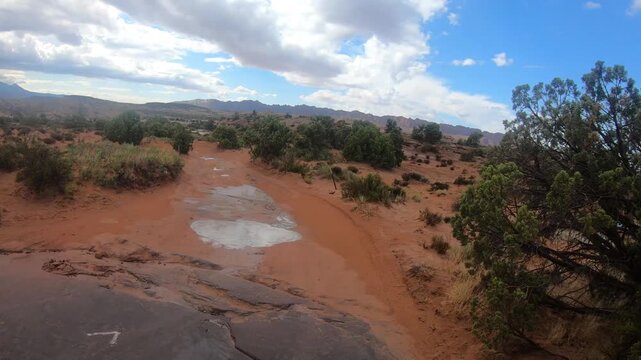 Cinematic travel footage of UTV exploring the landscapes around Moab Utah with dramatic scenery