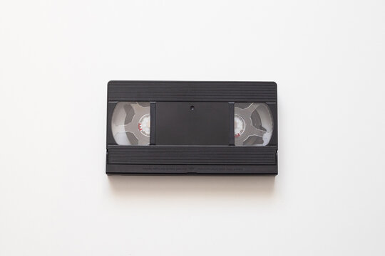 Retro video tape isolated on white surface brings back analog memories, video tape format stored family moments and tv recordings, retro object perfect for nostalgia themed stock photography or design