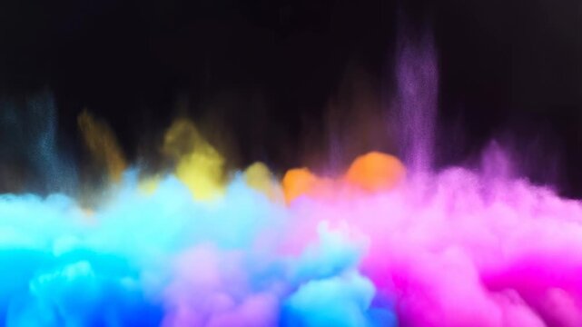 Colorful smoke clouds swirling against a dark background. Vibrant visual effects for creative projects and artistic expressions