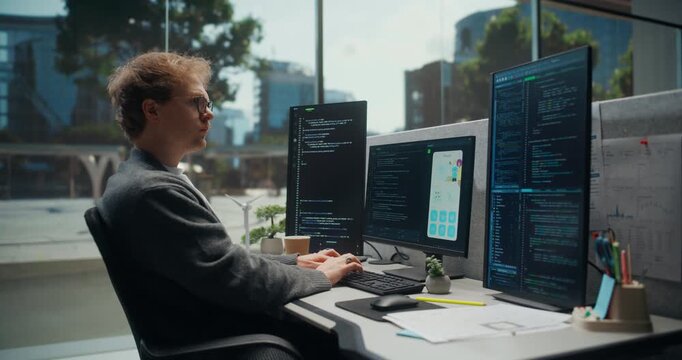Focused App Developer Builds and Debugs a Smartphone Interface Across Triple Monitors, Reviewing Code, UI Layouts, Analytics Printouts, Agile Planning Notes in Tech Office. Working Using Computer