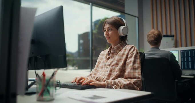 Portrait of Female Software Engineer Prototypes an AI powered Ecommerce Platform, Testing Code, Mobile UX, API Logic and Cyber Security Workflows. App Development Office.  Working Using Computer