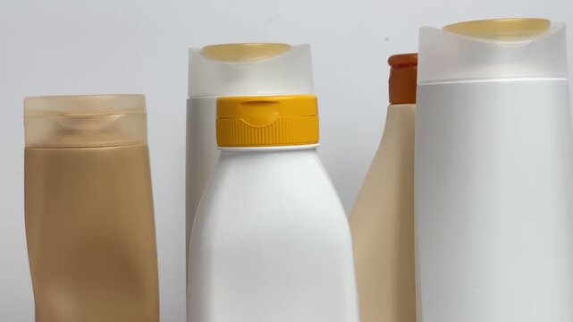Aesthetic vertical b-roll with zoom out of sorted cosmetic packaging in a recycled paper wrap