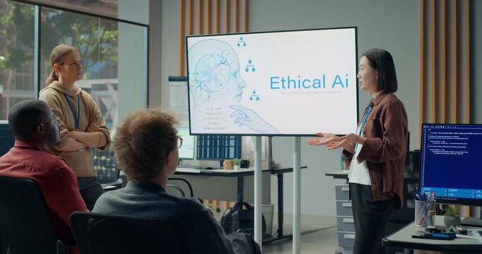 Office Presentation Meeting: Asian Female Software Engineer Presents Ethical Ai Principles on Large Screen as Multiethnic Developer Team Discusses App Coding, Cybersecurity and Interface Optimisation