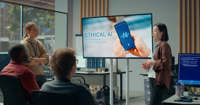 Office Presentation Meeting: Young Female Tech Lead Explains Ethical Ai Development Roadmap on Big Screen While Curious Software Developers Brainstorm App Coding, Cybersecurity and Ux Optimisation