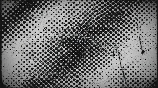 A dark messy explosion occurs on a metal grated surface indoors.
