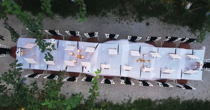 Outdoor artistic gathering with paint class stylish table surrounded by trees