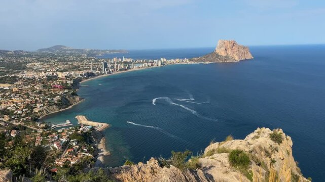 Drone aerial view from Morro de Toix overlooking the coastline of Calpe and the iconic Pe&ntilde;&oacute;n de Ifach, Spain