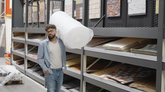 Man shopping for floor underlay at a hardware store