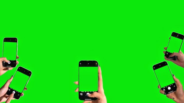 Hand Holding Smartphone With Green Screen