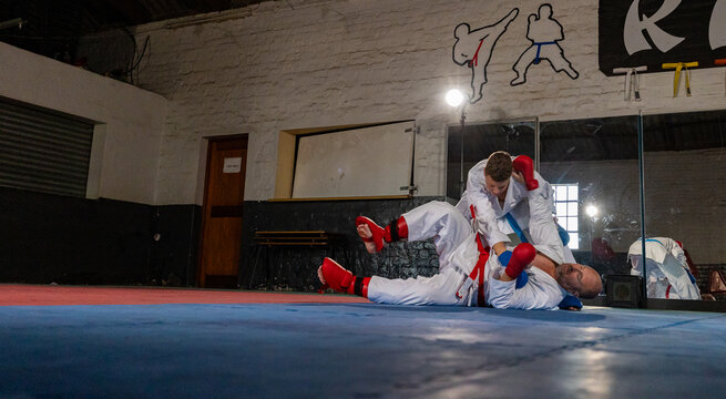 Karate instructor demonstrating ground fighting technique