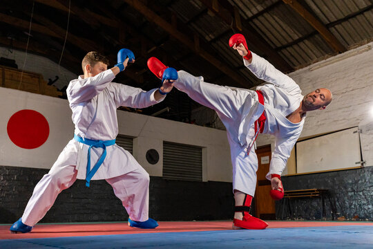Karate sparring match with high kick technique