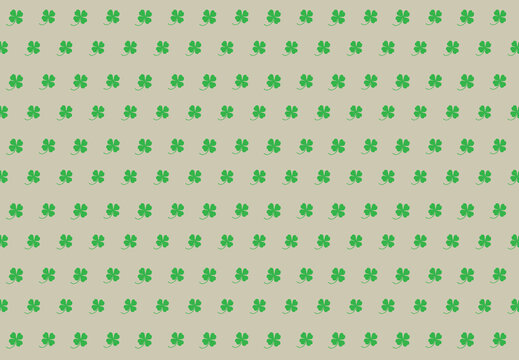 Green clover leaves on a Cornsilk background for the background. Clover leaves for the background.