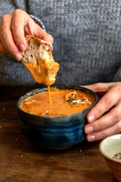 Creamy tomato soup with bread.