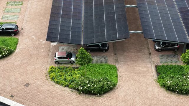 High angle view of parking lot with solar panel covered carports