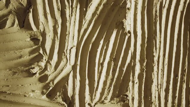 Textured Clay Plaster Background with Trowel Marks