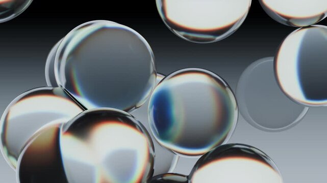 Abstract Glass Bubbles With Reflections Video On Gradient Background Surface. A digital 3D rendering of floating transparent glass bubbles displaying chromatic dispersion and sharp reflections. 