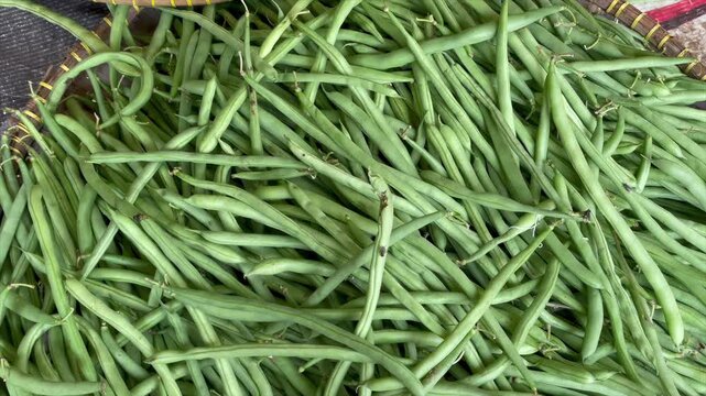 Fresh green string beans at a traditional market
