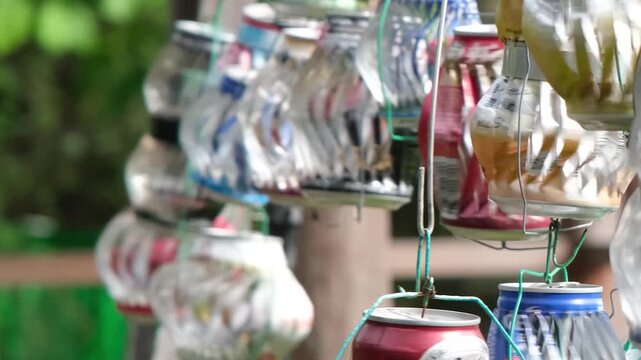aluminum soda can wind spinners in the garden spinning in the wind