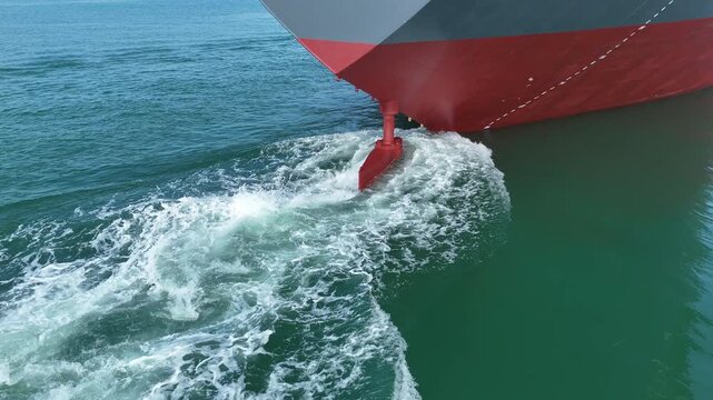 Propeller of large ship underwater spinning power working and water splash contrail . Close up image detail of Propeller ship, Logistics Transportation industry express technology of ship. Freight